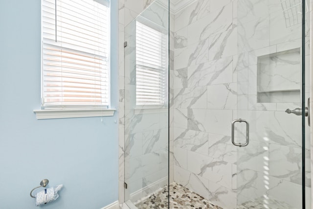 bathroom with a shower stall