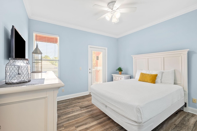 bedroom featuring dark wood-type flooring, crown molding, and baseboards