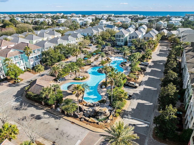 birds eye view of property with a water view and a residential view