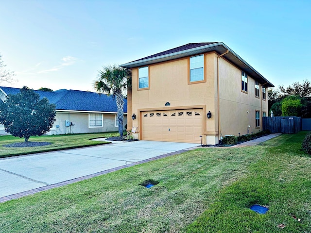 view of front of property with a garage and a front lawn