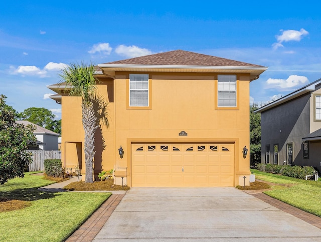 front facade featuring a front lawn and a garage