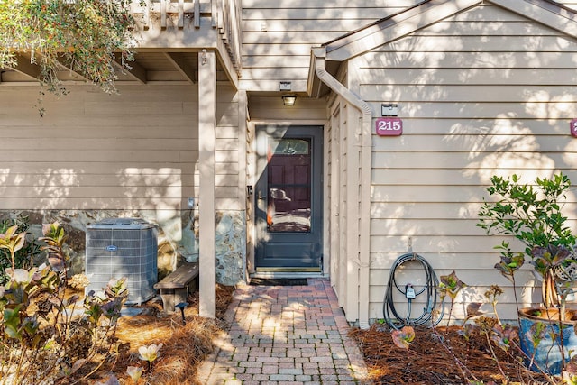 view of exterior entry featuring central AC