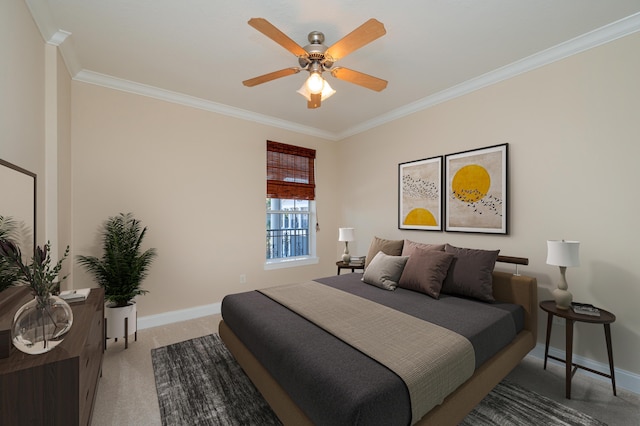 carpeted bedroom with ceiling fan and ornamental molding