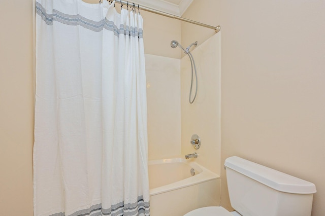 bathroom with ornamental molding, shower / bath combination with curtain, and toilet