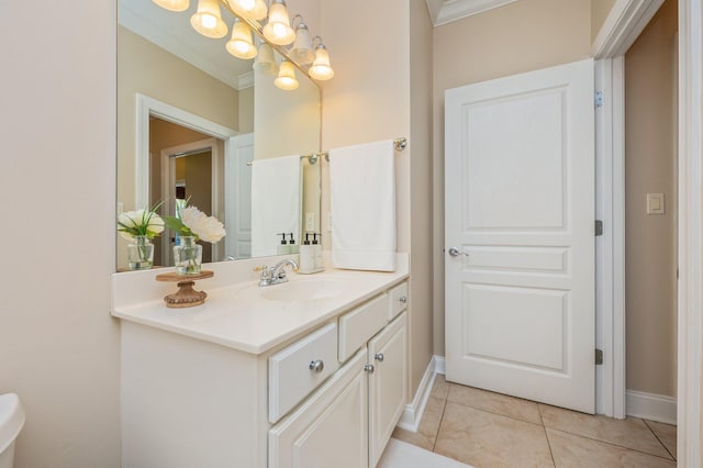 bathroom with tile patterned floors, vanity, ornamental molding, and a notable chandelier