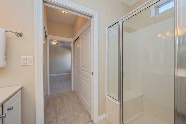 bathroom with vanity and a shower with shower door