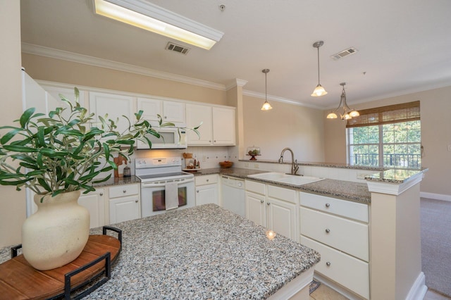 kitchen featuring white cabinets, white appliances, light stone countertops, and sink