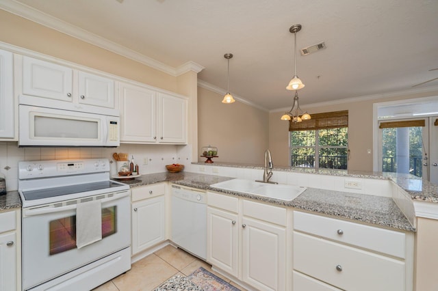 kitchen with white cabinetry, sink, a chandelier, and white appliances