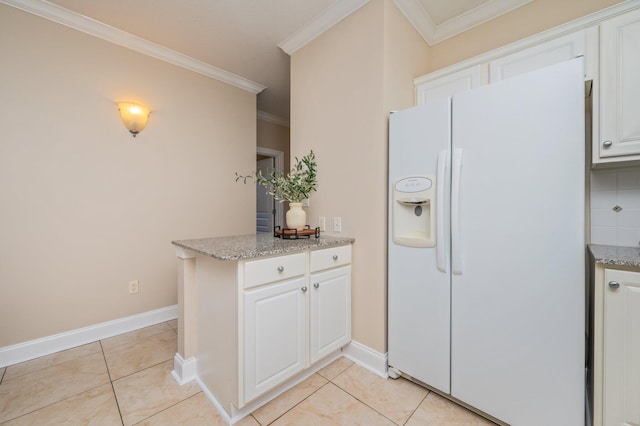 kitchen with white cabinetry, light stone countertops, white refrigerator with ice dispenser, and light tile patterned floors