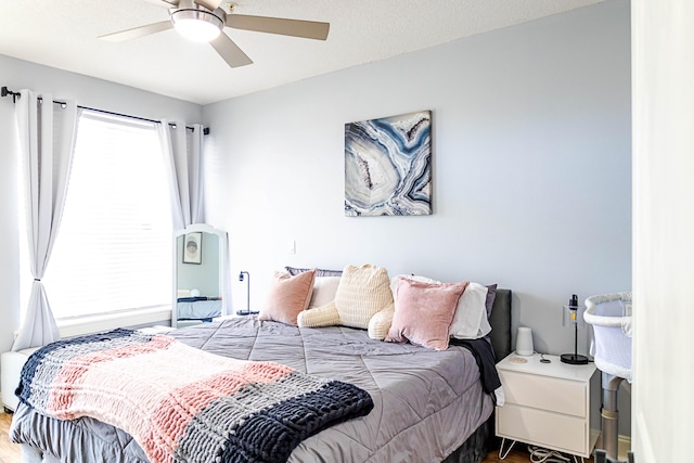 bedroom featuring ceiling fan and wood finished floors