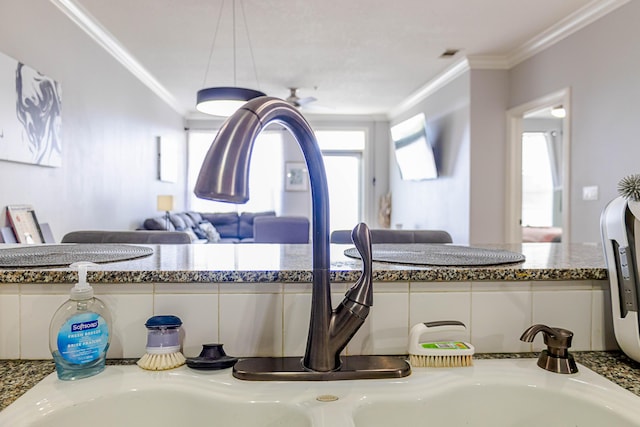 room details with ornamental molding, stone countertops, and visible vents