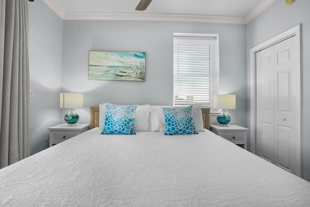 bedroom with ceiling fan, crown molding, and a closet