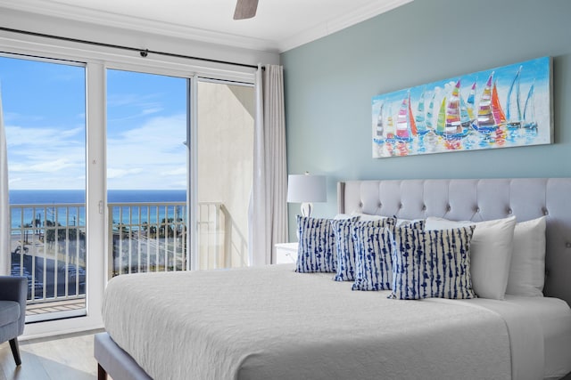 bedroom with access to outside, ceiling fan, a water view, and ornamental molding