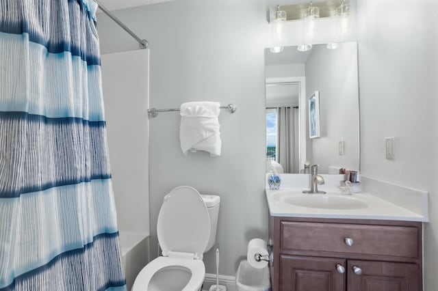 full bathroom featuring vanity, shower / bath combination, and toilet