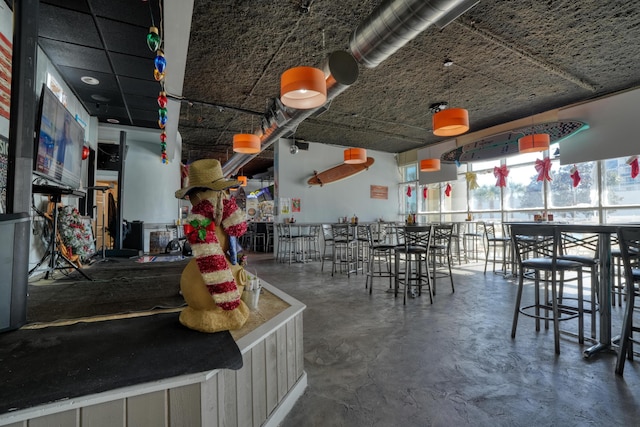 dining area featuring concrete flooring