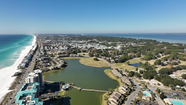 drone / aerial view featuring a view of the beach and a water view