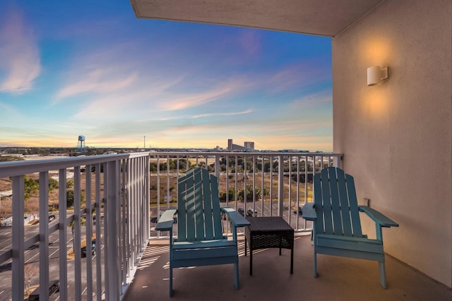 view of balcony at dusk