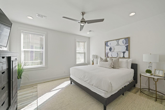 bedroom featuring ceiling fan and light hardwood / wood-style flooring