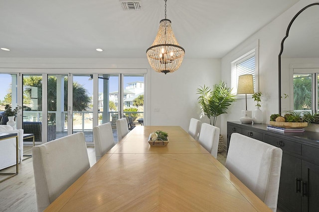 dining area with a notable chandelier