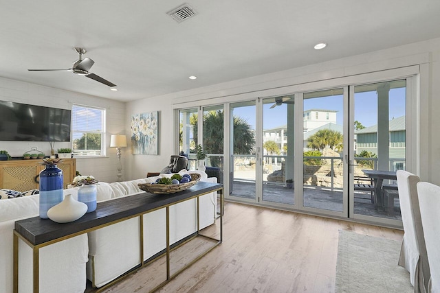 interior space with ceiling fan, light hardwood / wood-style floors, and access to exterior