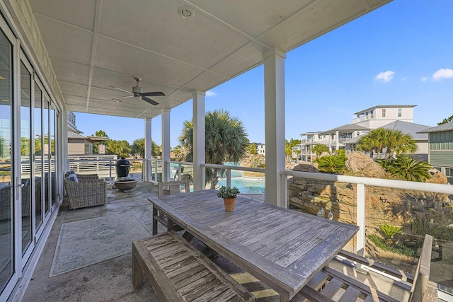 unfurnished sunroom with ceiling fan and plenty of natural light