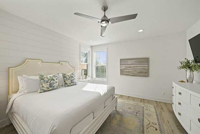 bedroom featuring ceiling fan and wood-type flooring