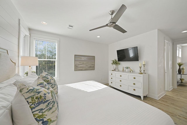 bedroom with ceiling fan and light wood-type flooring