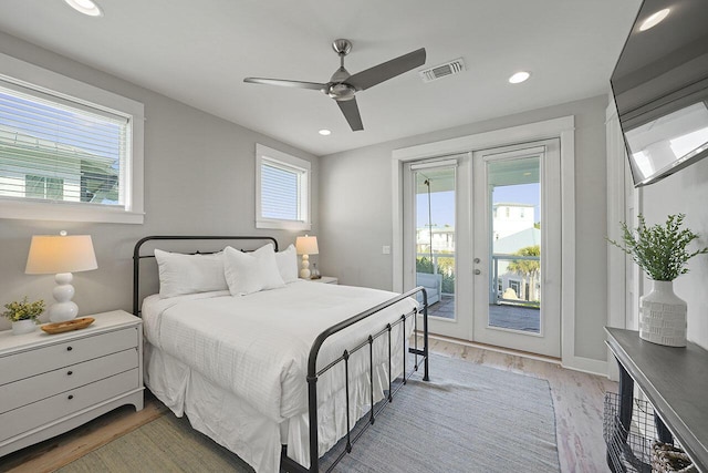 bedroom with wood-type flooring, french doors, access to outside, and ceiling fan