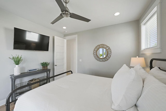 bedroom featuring hardwood / wood-style flooring and ceiling fan