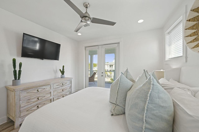 bedroom with access to exterior, french doors, light hardwood / wood-style flooring, and ceiling fan