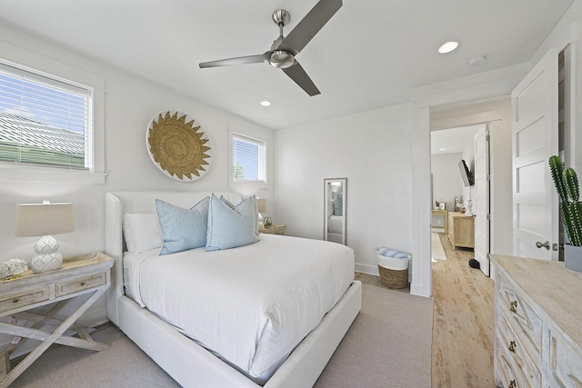 bedroom with light wood-type flooring and ceiling fan