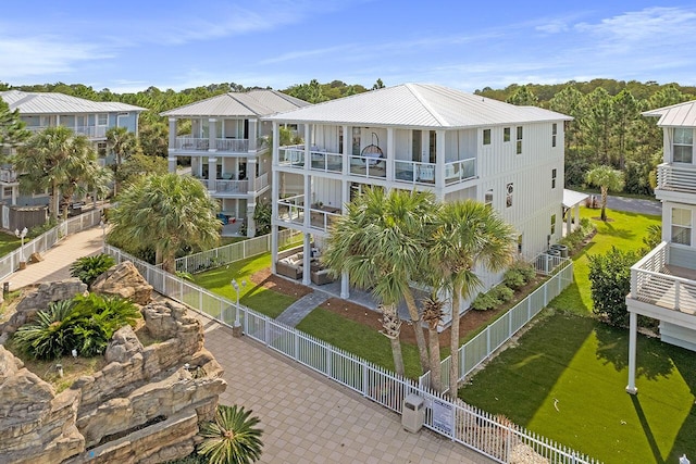 rear view of house featuring a balcony