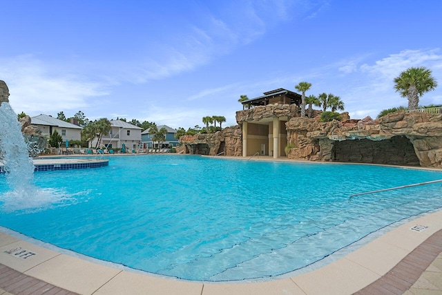 view of pool with pool water feature