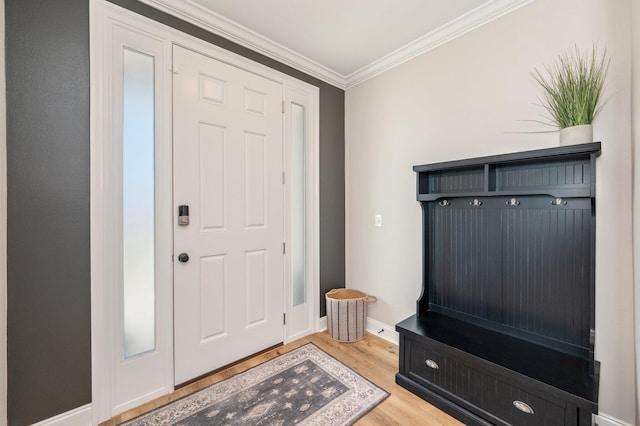 mudroom with light hardwood / wood-style floors and crown molding