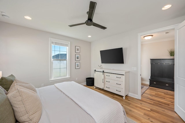 bedroom featuring ceiling fan and light wood-type flooring