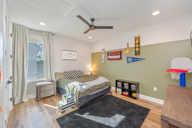 bedroom with light hardwood / wood-style flooring and ceiling fan