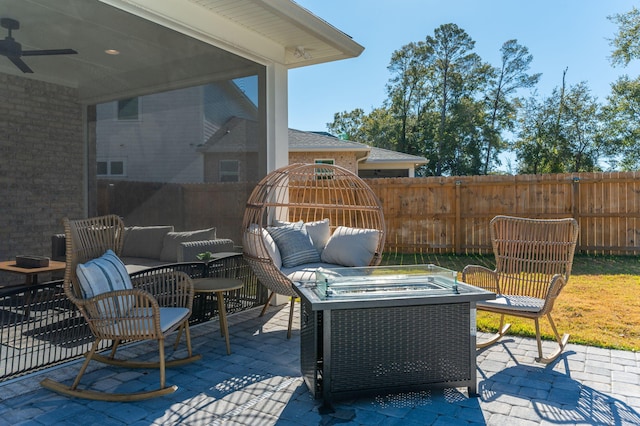 view of patio / terrace with an outdoor living space with a fire pit