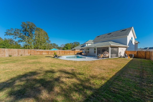 view of yard with a fenced in pool and a patio area