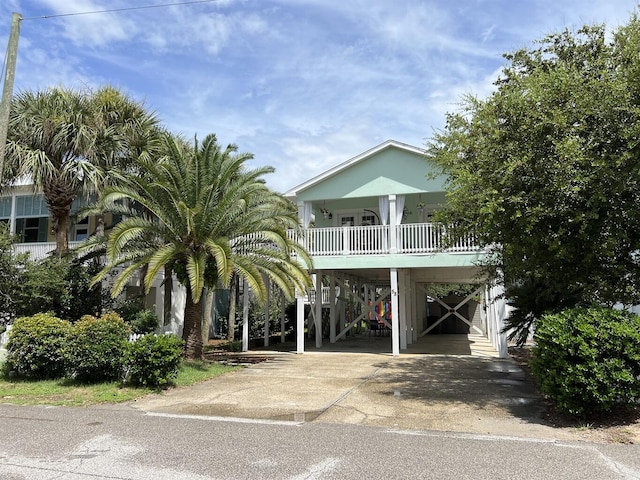 view of front of property featuring a carport and covered porch