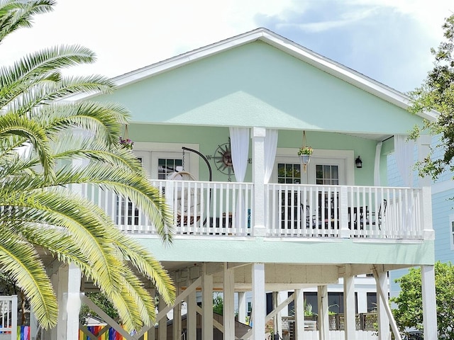 back of property featuring a carport