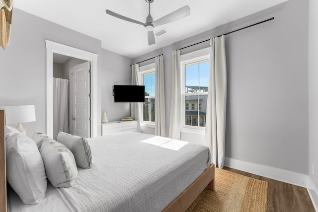 bedroom with ceiling fan and hardwood / wood-style floors