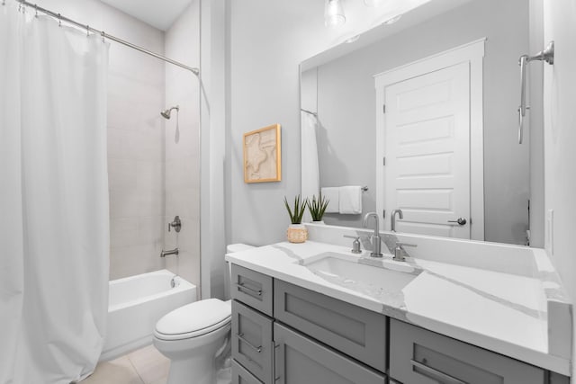 full bathroom with vanity, tile patterned floors, toilet, and shower / bath combo