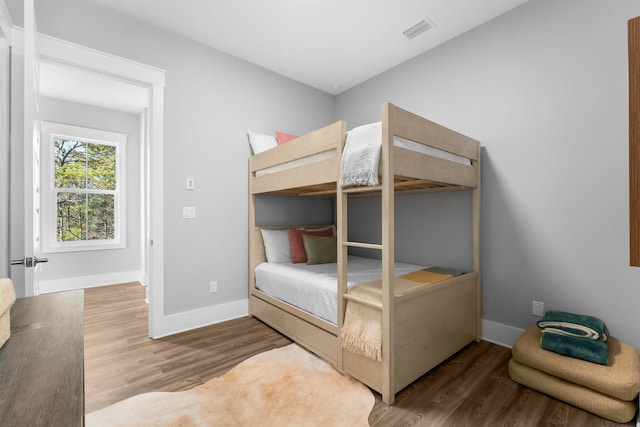 unfurnished bedroom with wood-type flooring