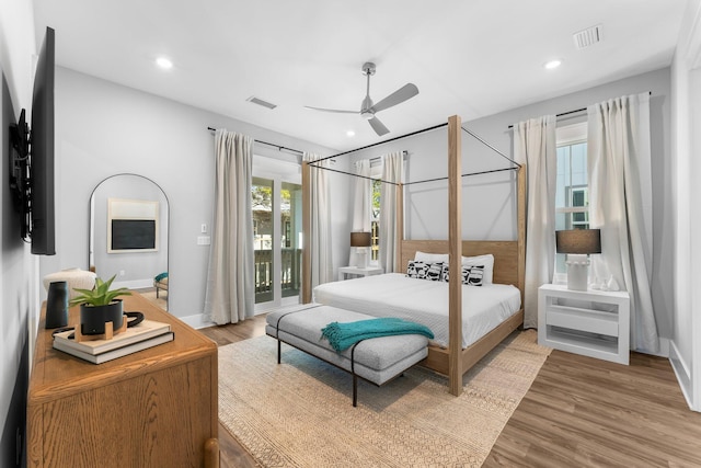 bedroom with ceiling fan, light hardwood / wood-style floors, and access to outside