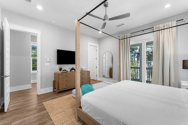 bedroom featuring hardwood / wood-style flooring, access to exterior, and ceiling fan