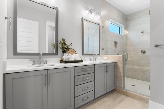 bathroom with vanity and an enclosed shower