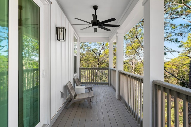 wooden deck featuring ceiling fan