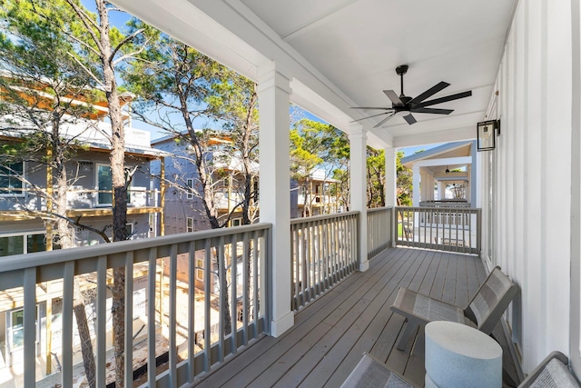 wooden deck featuring ceiling fan