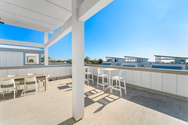 view of patio with an outdoor bar