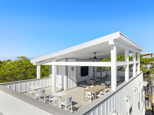 wooden deck featuring an outdoor hangout area and ceiling fan